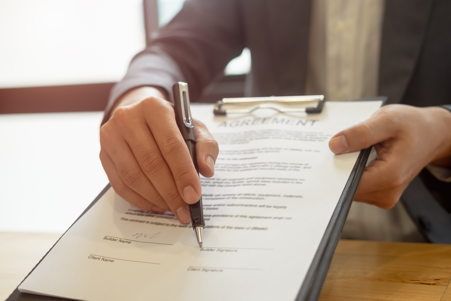 Businessman Reaching Out a Document with Contract Agreement